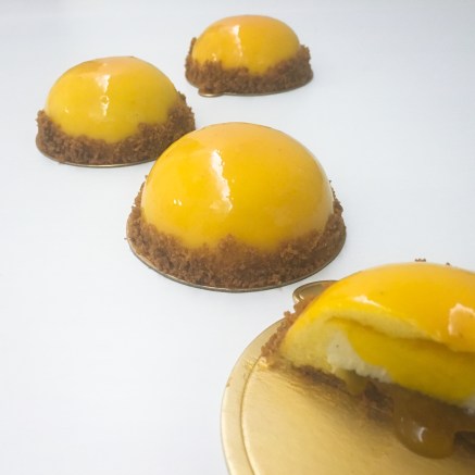 Mango mousse & vanilla cheesecake entremet on a crunchy caramel cookie