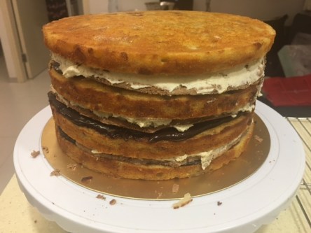 Assembling the layers of the drip cake