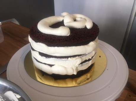 Coat the black forest cake with the remaining Chantilly cream